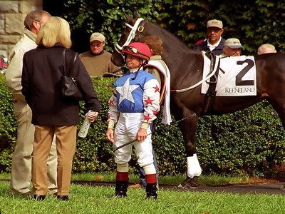 Jockey Standing with Horse and Owner
